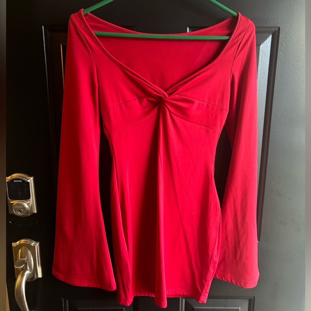 Women’s long sleeve bodycon dress. Bell sleeve, square neck, and low cut.